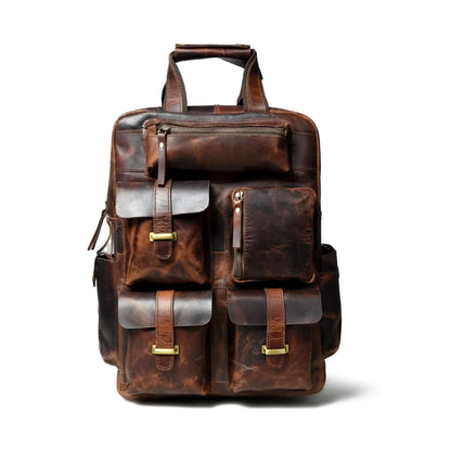 Front view of the distressed leather backpack showing buckled flap pockets and zip pocket
