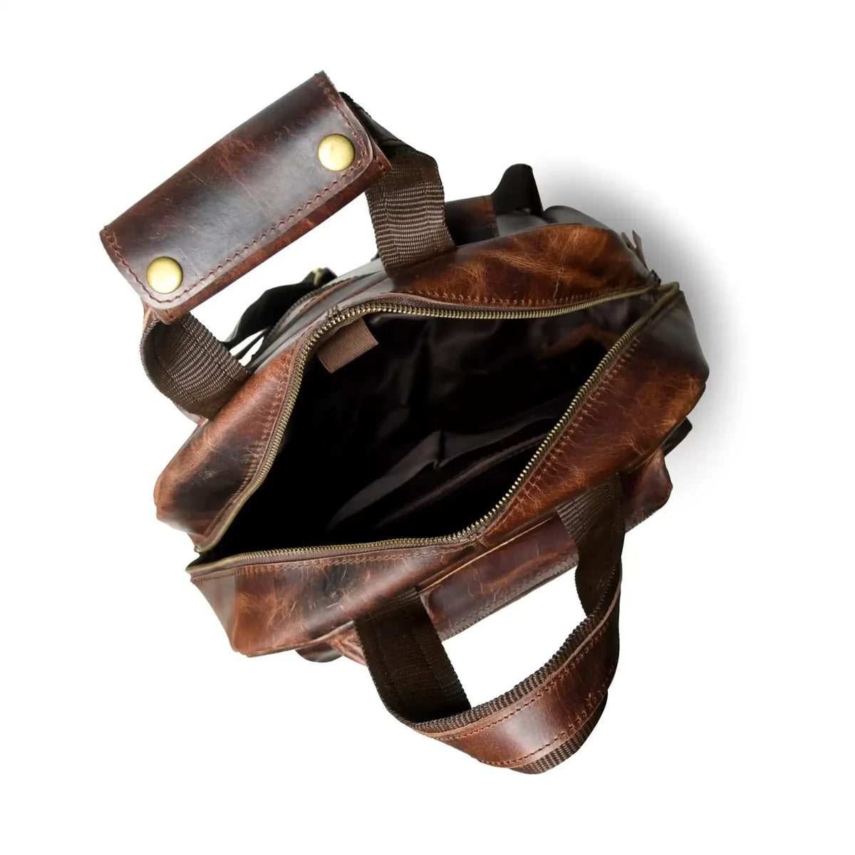 Open distressed leather backpack showing the lined main compartment