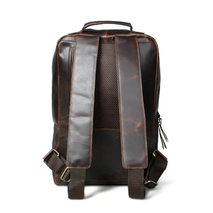 Back of the espresso leather backpack showing the padded mesh panel and straps