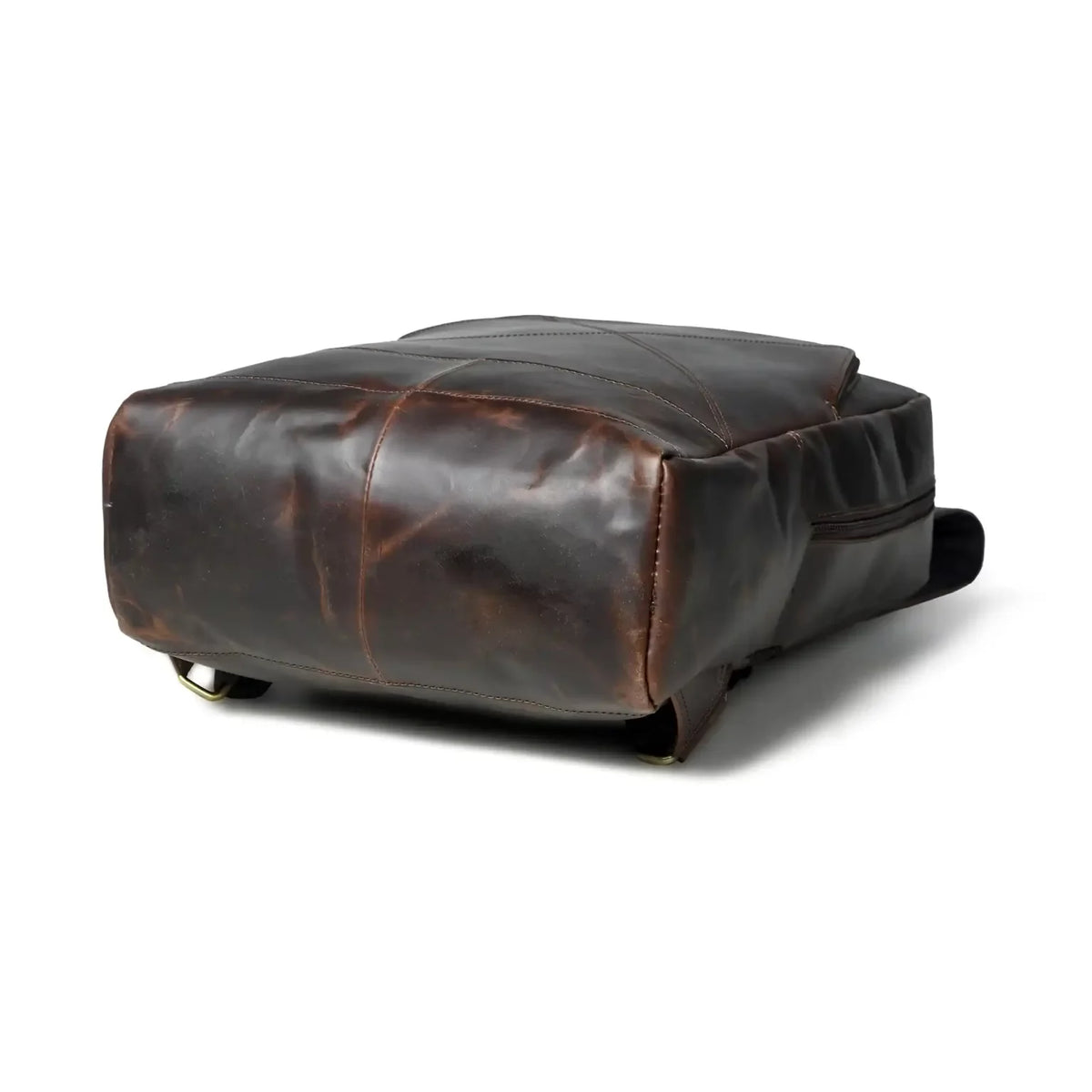 Side profile of the espresso leather laptop backpack showing its slim depth
