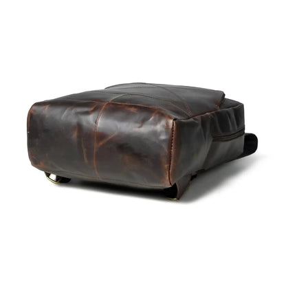 Side profile of the espresso leather laptop backpack showing its slim depth