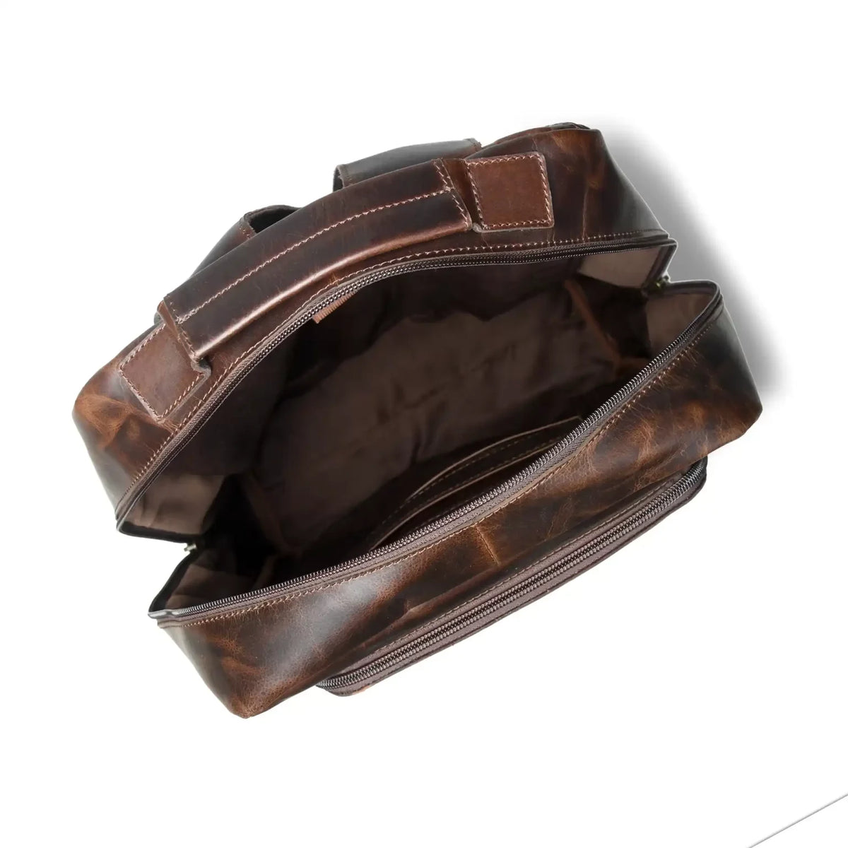 Open espresso leather backpack showing the lined main compartment