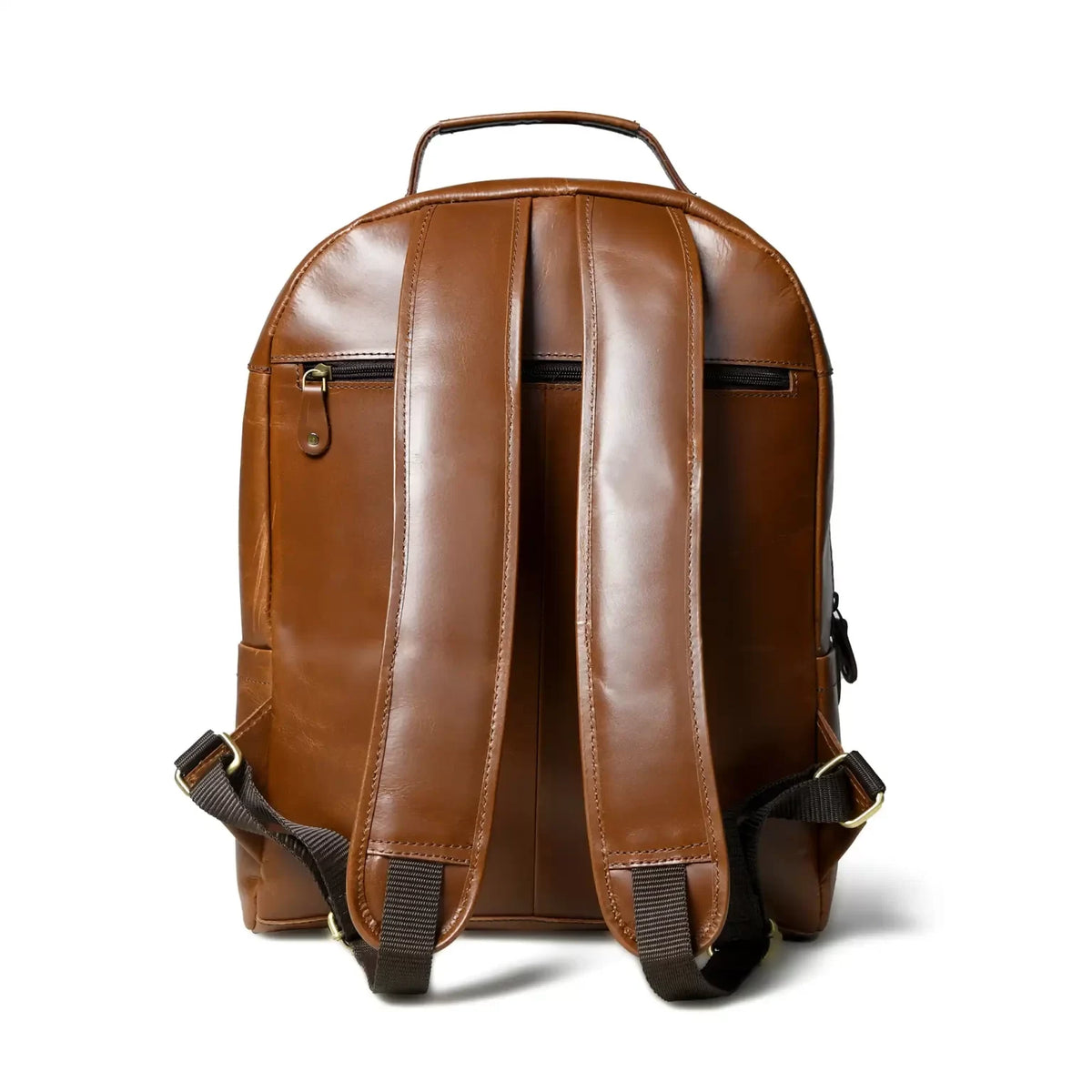Back of the cognac leather backpack showing hidden zip pockets and padded straps