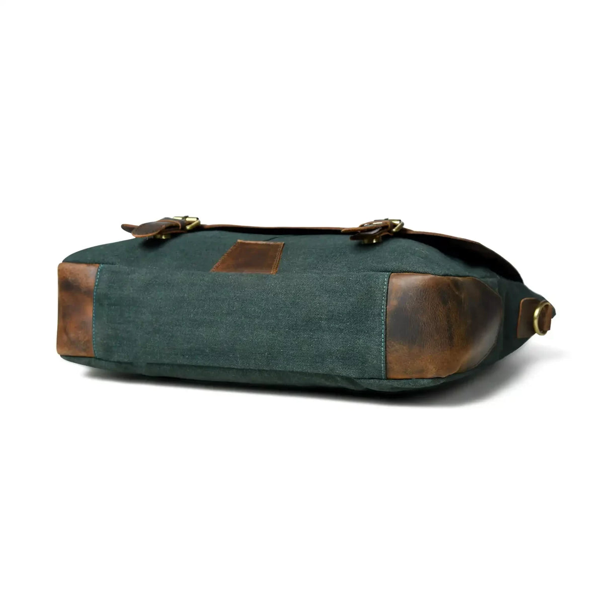 Side profile of the green canvas office bag showing the leather base corners